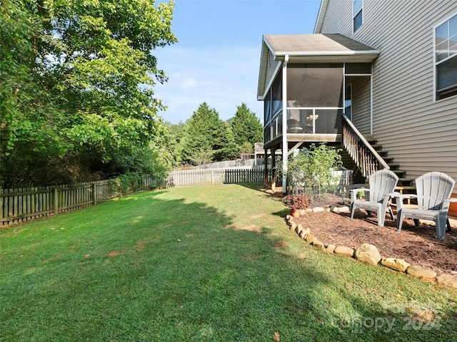 view of yard with a sunroom