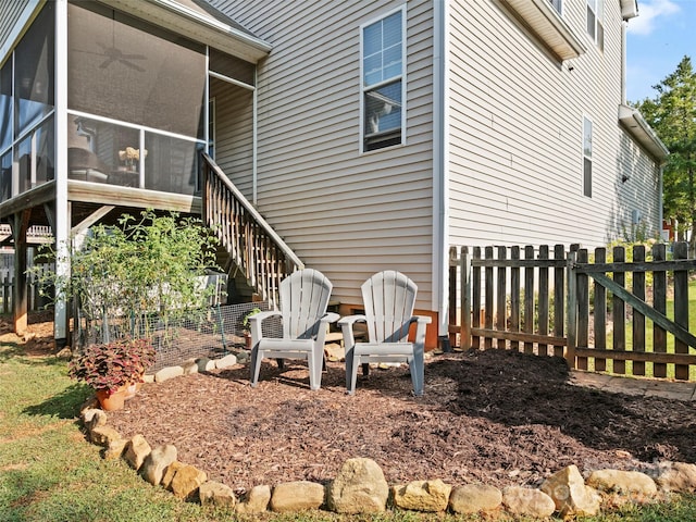 exterior space featuring a sunroom