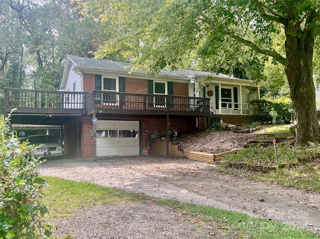 view of front of house with a garage and a deck