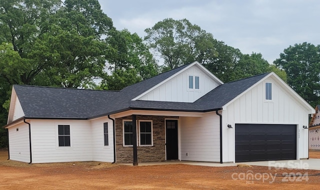 modern farmhouse style home with a garage