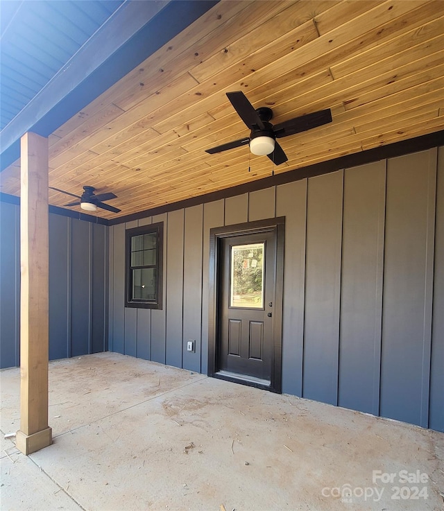 doorway to property with a patio and ceiling fan