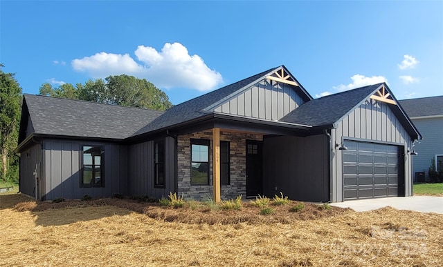 view of front of house with a garage and a front yard