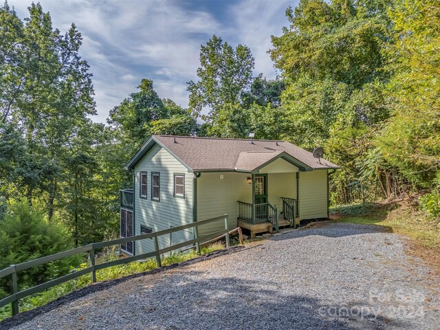 view of side of property with a porch