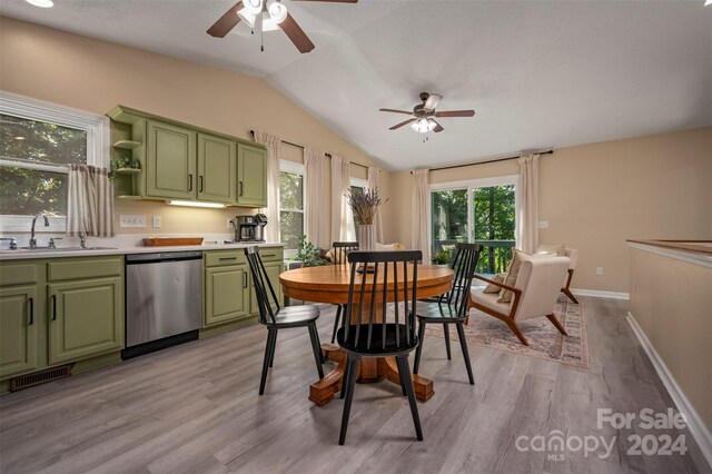 dining room with vaulted ceiling, sink, ceiling fan, and light hardwood / wood-style floors