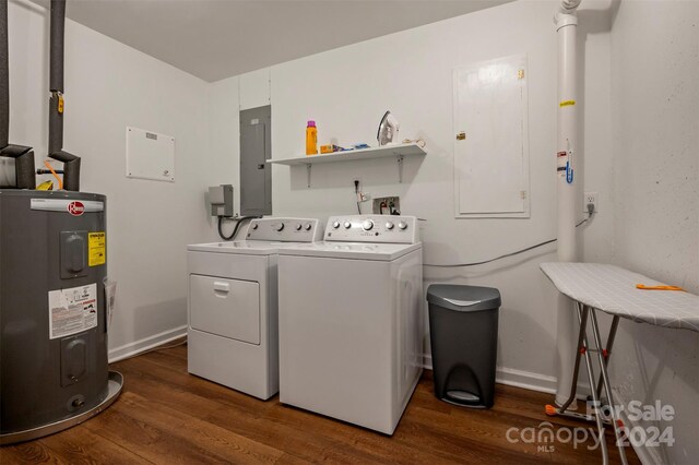 laundry area featuring electric panel, dark wood-type flooring, washer and dryer, and water heater