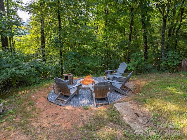 view of yard with an outdoor fire pit