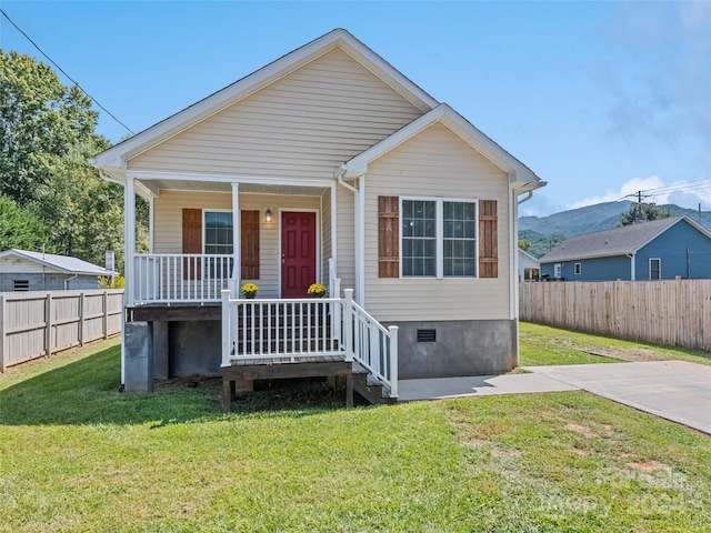 bungalow-style home featuring a front yard and a porch