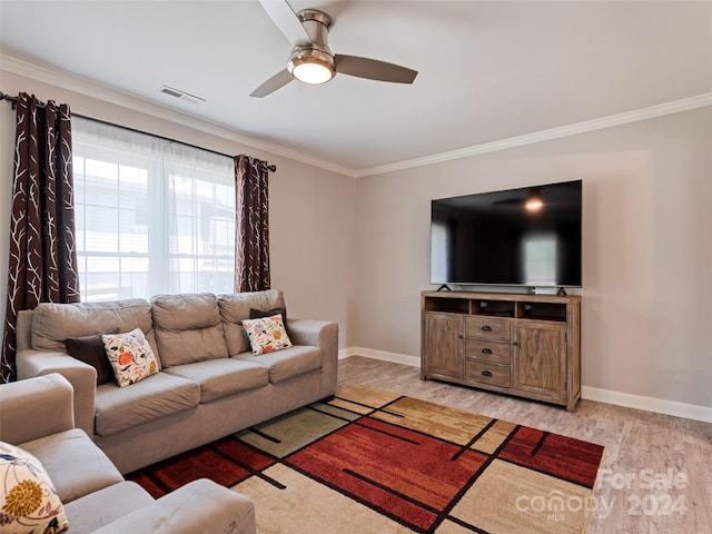 living room with light wood-type flooring, crown molding, and ceiling fan