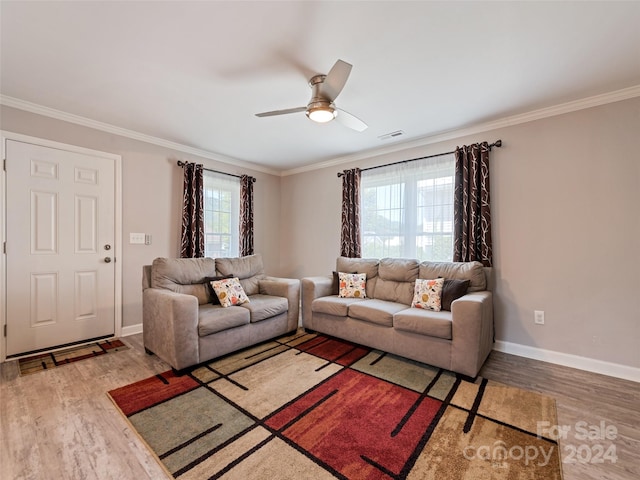 living room with ceiling fan, ornamental molding, and hardwood / wood-style floors