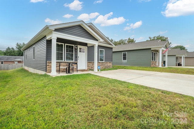 craftsman inspired home with a front lawn