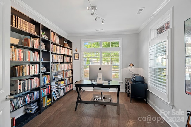 home office with crown molding, track lighting, and dark hardwood / wood-style floors