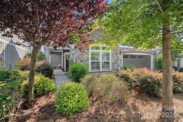 obstructed view of property with a garage