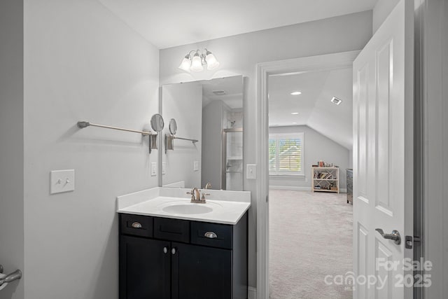 bathroom featuring vanity and vaulted ceiling