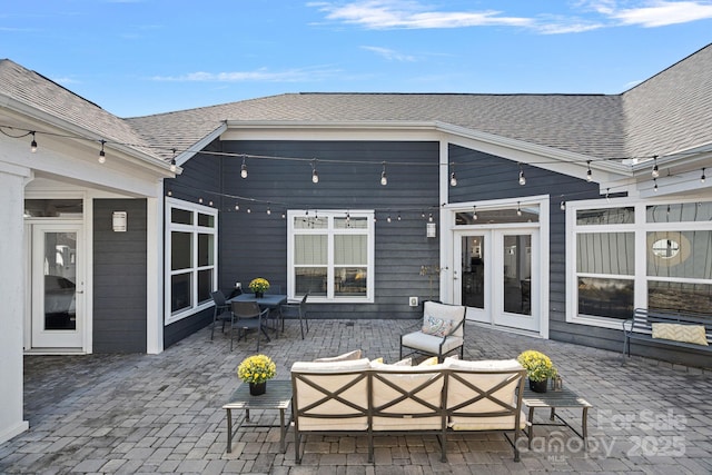 view of patio featuring an outdoor living space and french doors