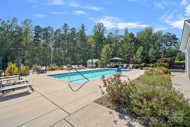 view of swimming pool featuring a gazebo and a patio