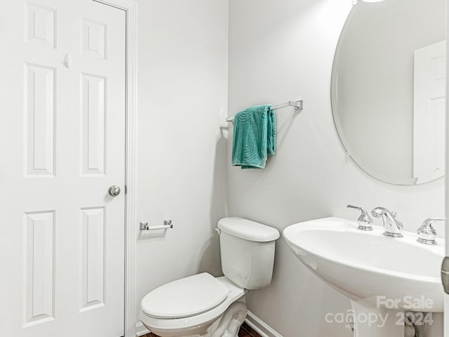 bathroom with toilet and sink