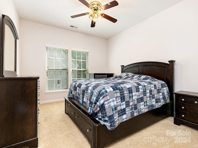 carpeted bedroom featuring ceiling fan