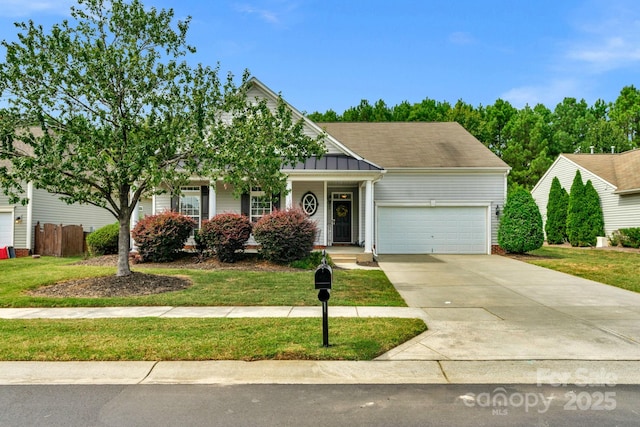 view of front of house featuring a garage and a front yard