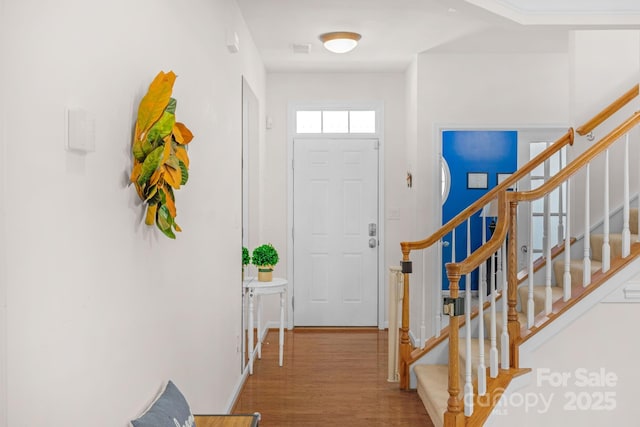 entryway with wood-type flooring