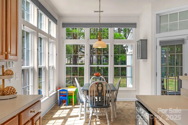 sunroom / solarium with a wealth of natural light