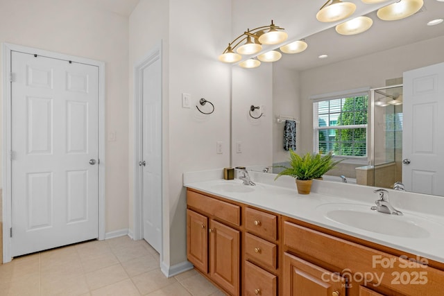 bathroom with vanity and a shower with door