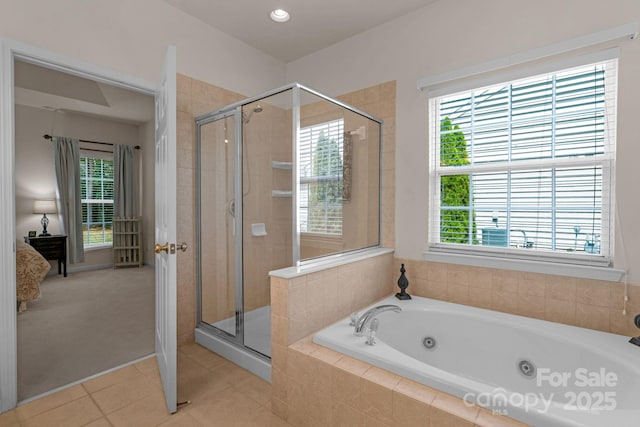 bathroom with tile patterned flooring and independent shower and bath