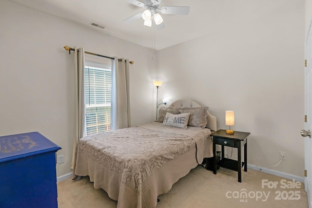 bedroom with light colored carpet and ceiling fan