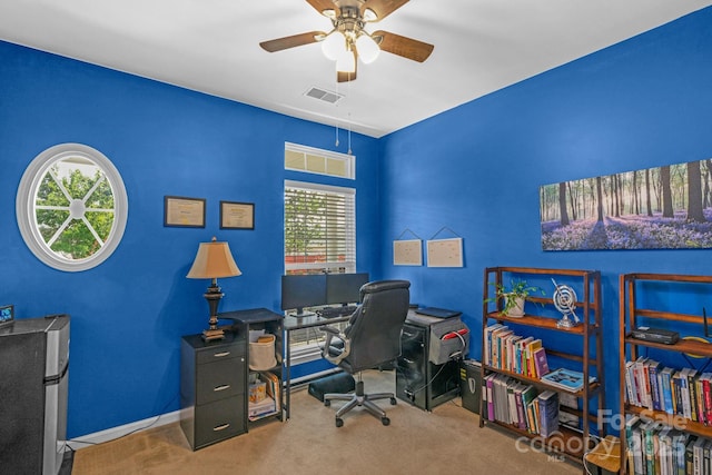 carpeted office with ceiling fan