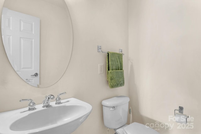 bathroom with toilet and sink