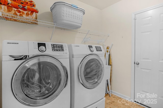 laundry room with washing machine and dryer