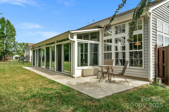 rear view of house with a lawn