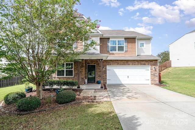 view of front facade featuring a front yard and a garage