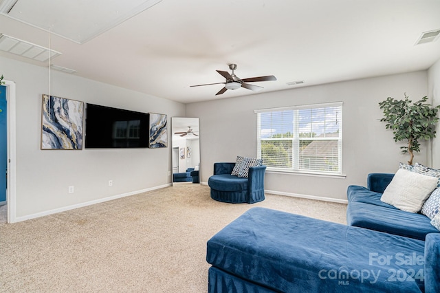 carpeted living room featuring ceiling fan