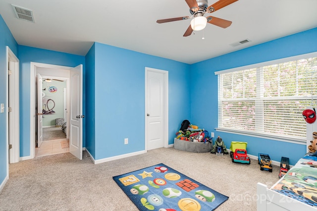 carpeted bedroom with ceiling fan