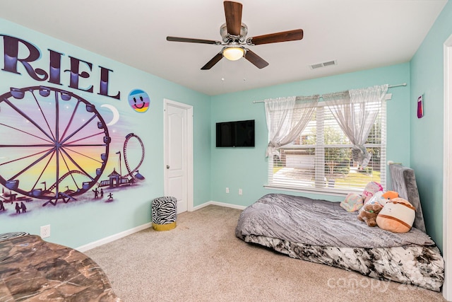 bedroom featuring ceiling fan and carpet