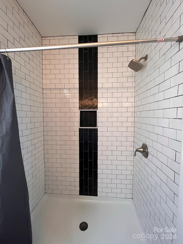 bathroom featuring walk in shower