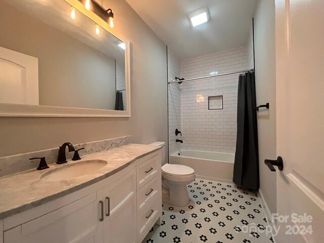 full bathroom featuring vanity, toilet, and shower / tub combo