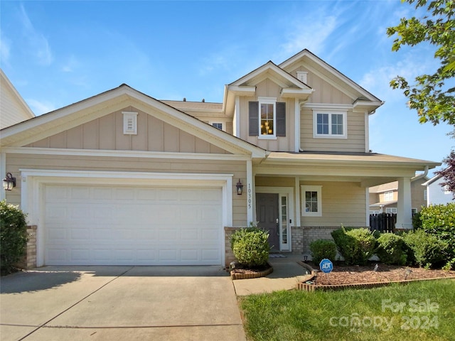 craftsman-style house featuring a garage and a porch