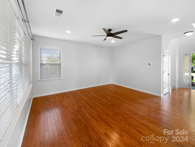 empty room featuring hardwood / wood-style floors and ceiling fan