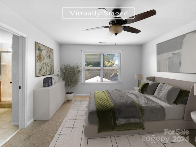 carpeted bedroom with ceiling fan