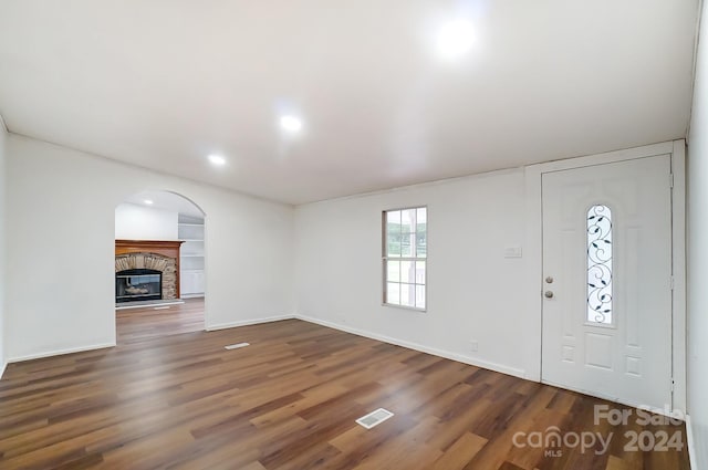 foyer entrance featuring dark wood-type flooring