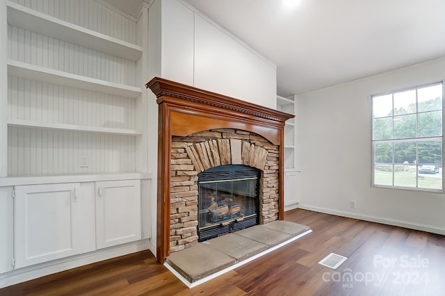 unfurnished living room featuring hardwood / wood-style flooring