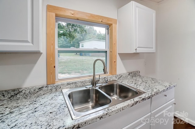 kitchen with sink and white cabinets