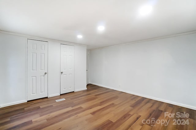 unfurnished bedroom featuring hardwood / wood-style flooring