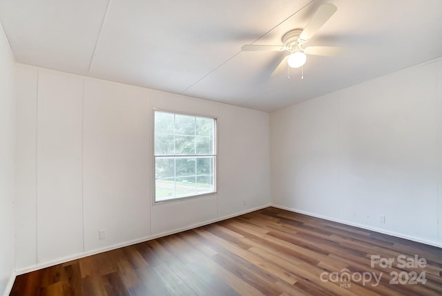 spare room with wood-type flooring and ceiling fan