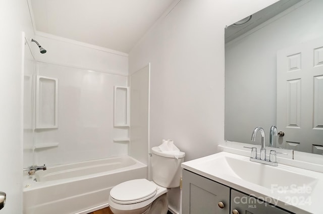 full bathroom featuring bathing tub / shower combination, vanity, and toilet