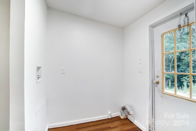 washroom with ornamental molding, washer hookup, and hardwood / wood-style flooring