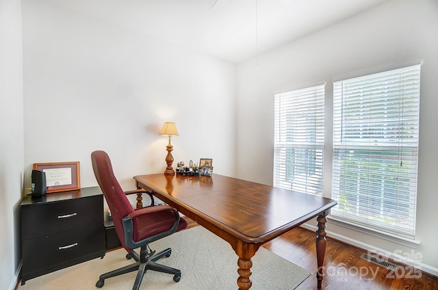 home office with hardwood / wood-style flooring