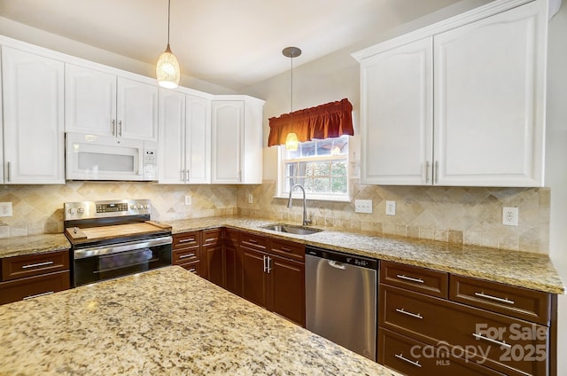 kitchen with white cabinetry, stainless steel appliances, sink, backsplash, and pendant lighting