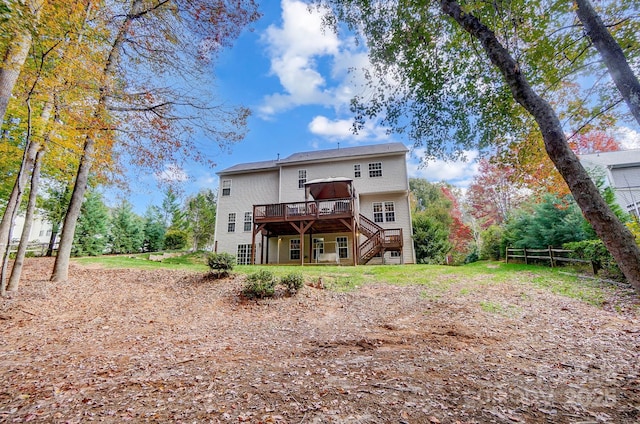 back of property featuring a wooden deck